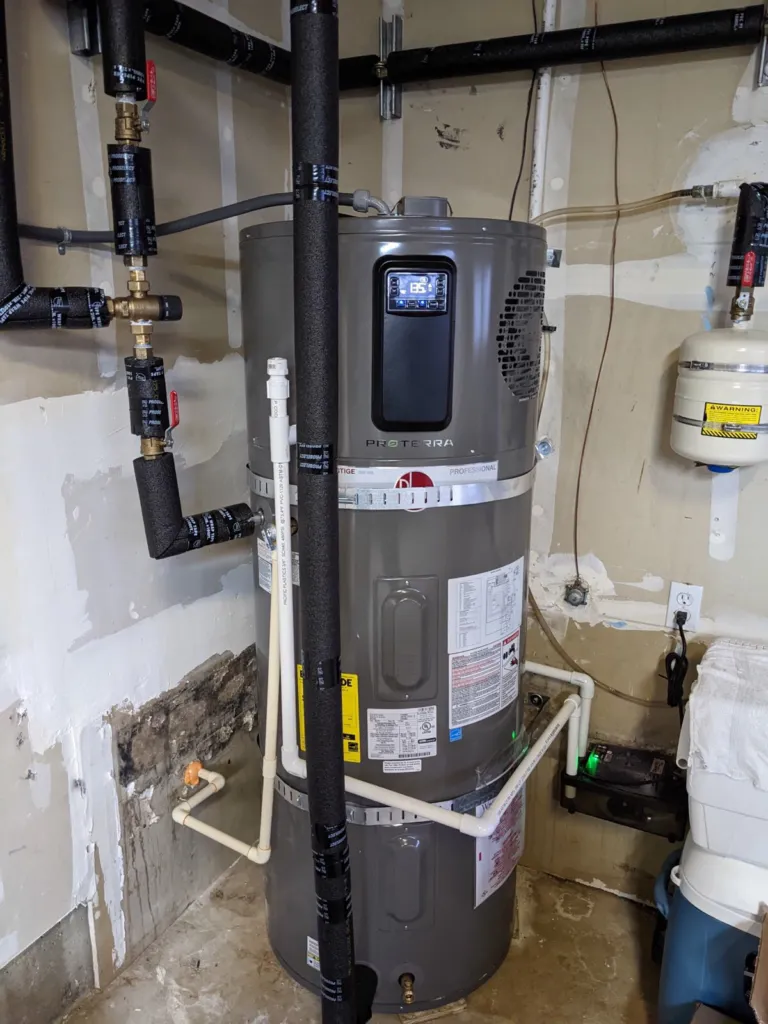 A heat pump water heater replaces the downstairs furnace and gas water heater.